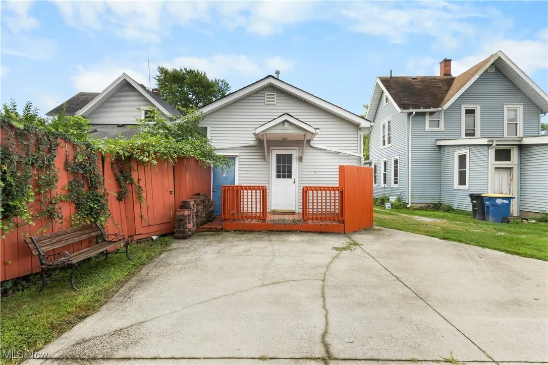 Rear view of house featuring a deck