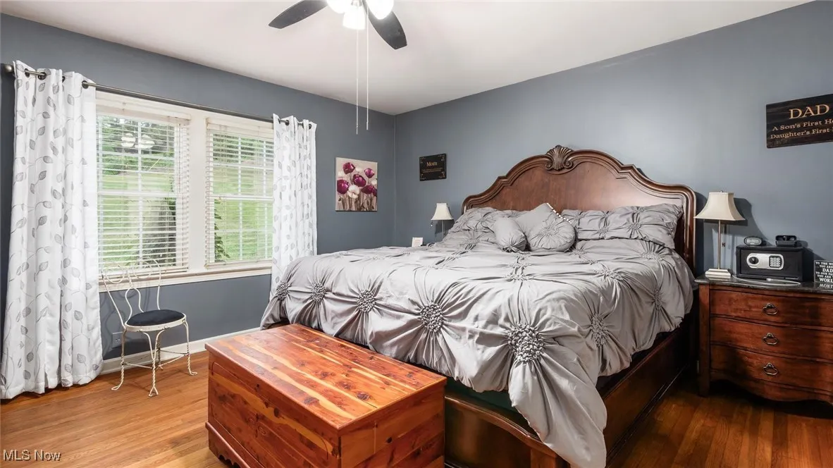 Bedroom featuring wood finished floors and ceiling fan