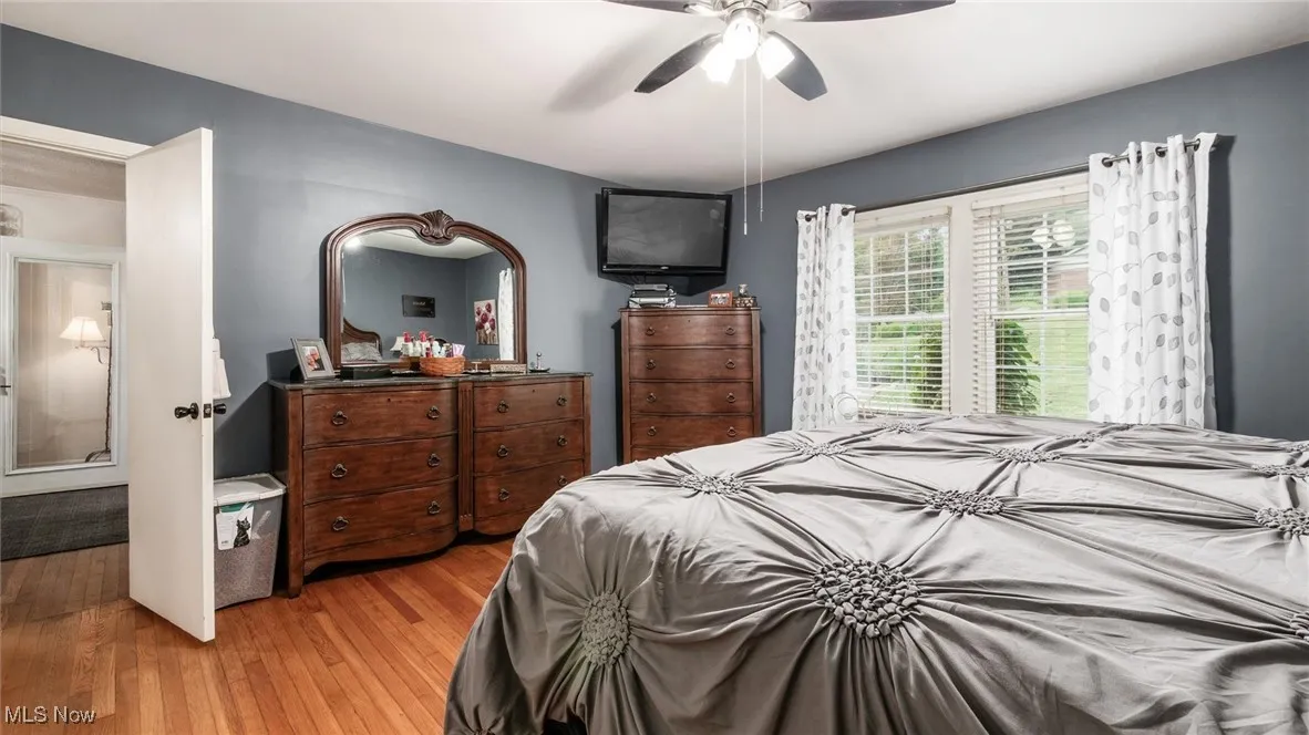 Bedroom featuring light wood-style floors and a ceiling fan