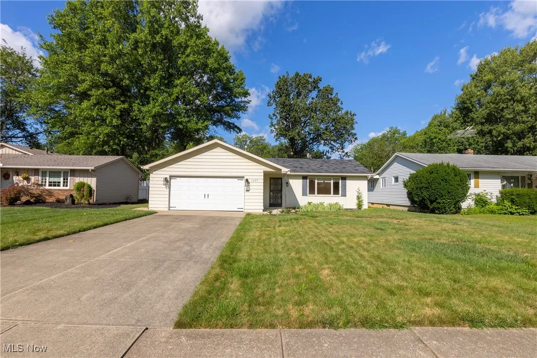 Single story home featuring a front lawn and driveway