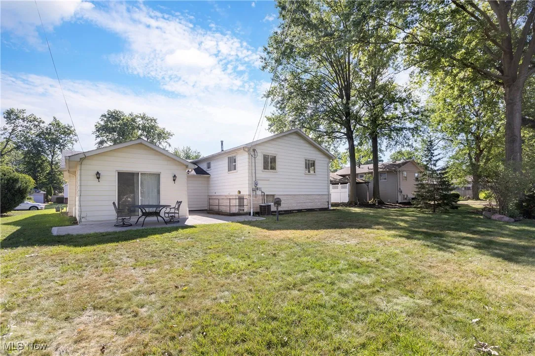 Rear view of property featuring a patio area