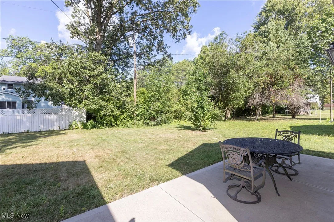 View of yard featuring a patio and outdoor dining space