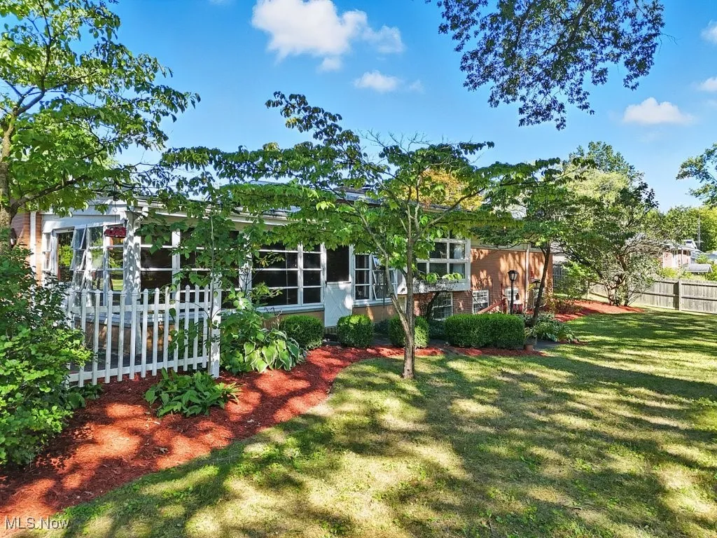 View of yard featuring a sunroom
