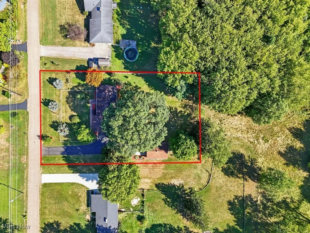 Aerial overview of property's location with property parcel outlined