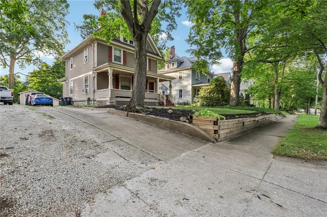 Traditional style home with covered porch and driveway