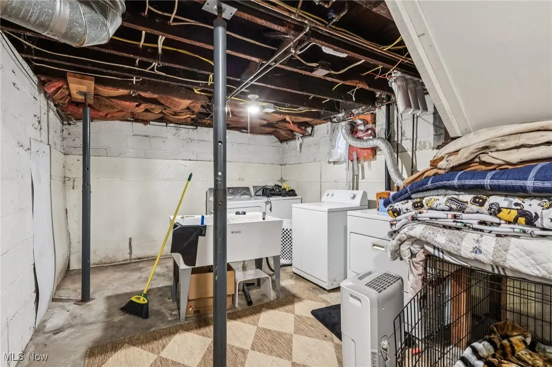 Unfinished basement with washer and dryer