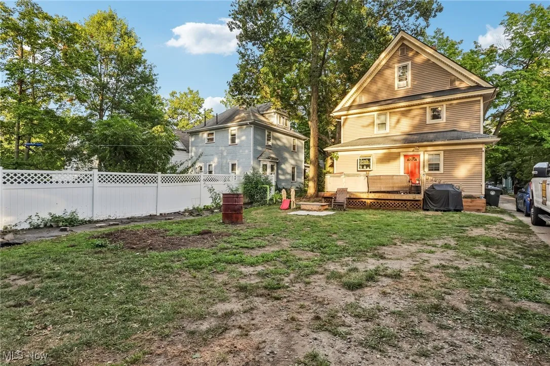 Back of house with a deck
