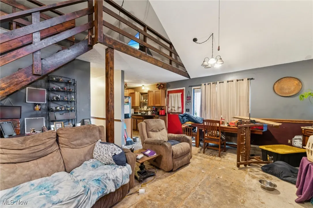 Living area with high vaulted ceiling
