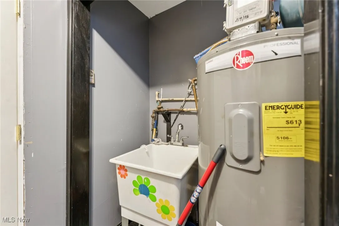 Utilities with electric water heater and a sink