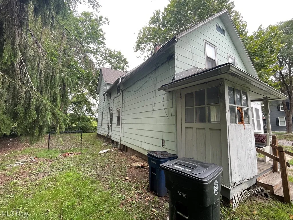 View of property exterior with a chimney