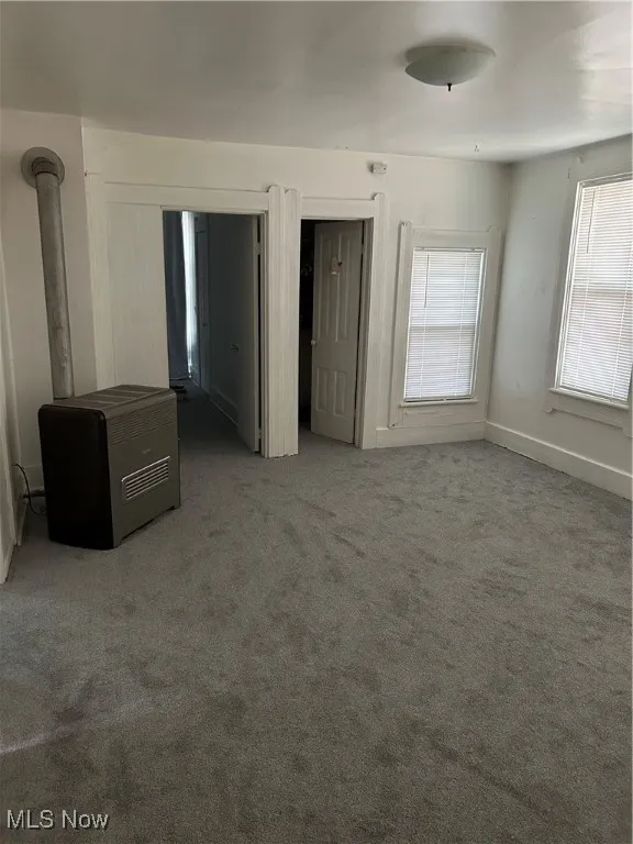 Unfurnished bedroom featuring carpet flooring