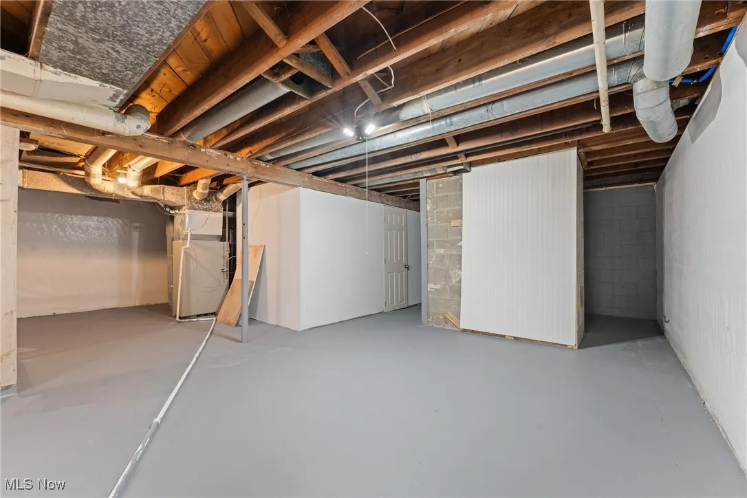 Unfinished basement with heating unit