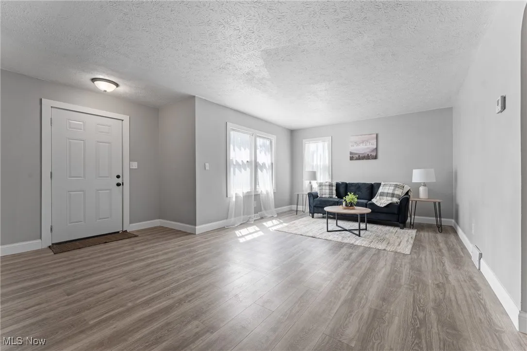 Foyer featuring wood finished floors and a textured ceiling