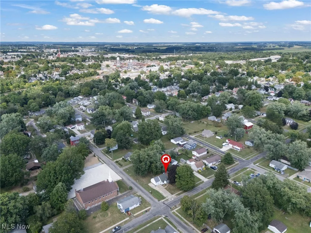 Aerial overview of property's location featuring nearby suburban area