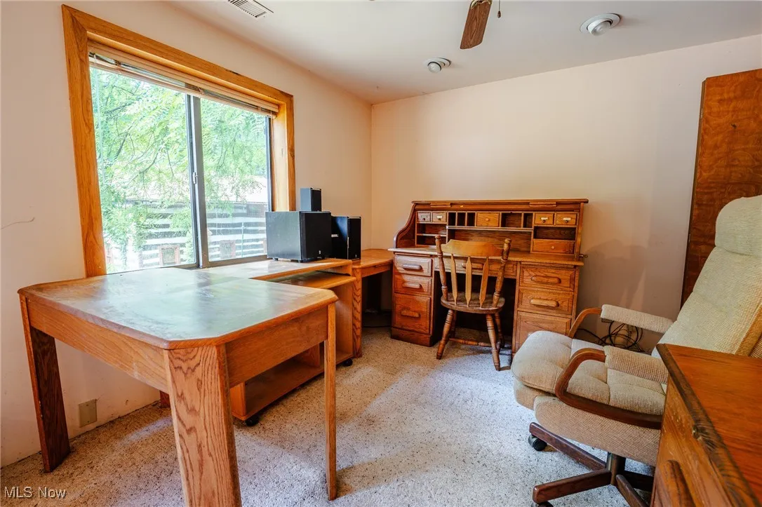 Office space with a ceiling fan
