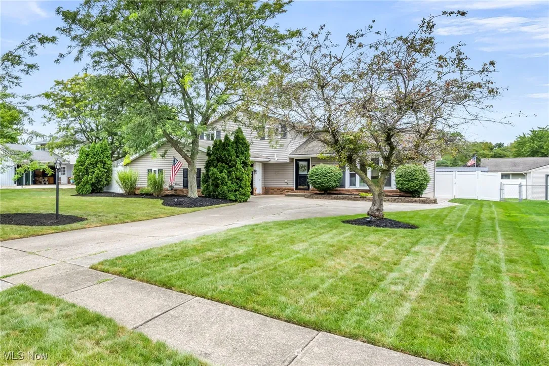 Traditional-style home with concrete driveway