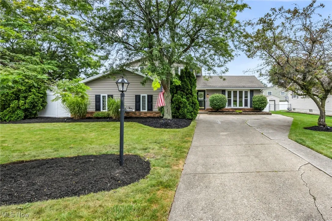 Ranch-style home with concrete driveway