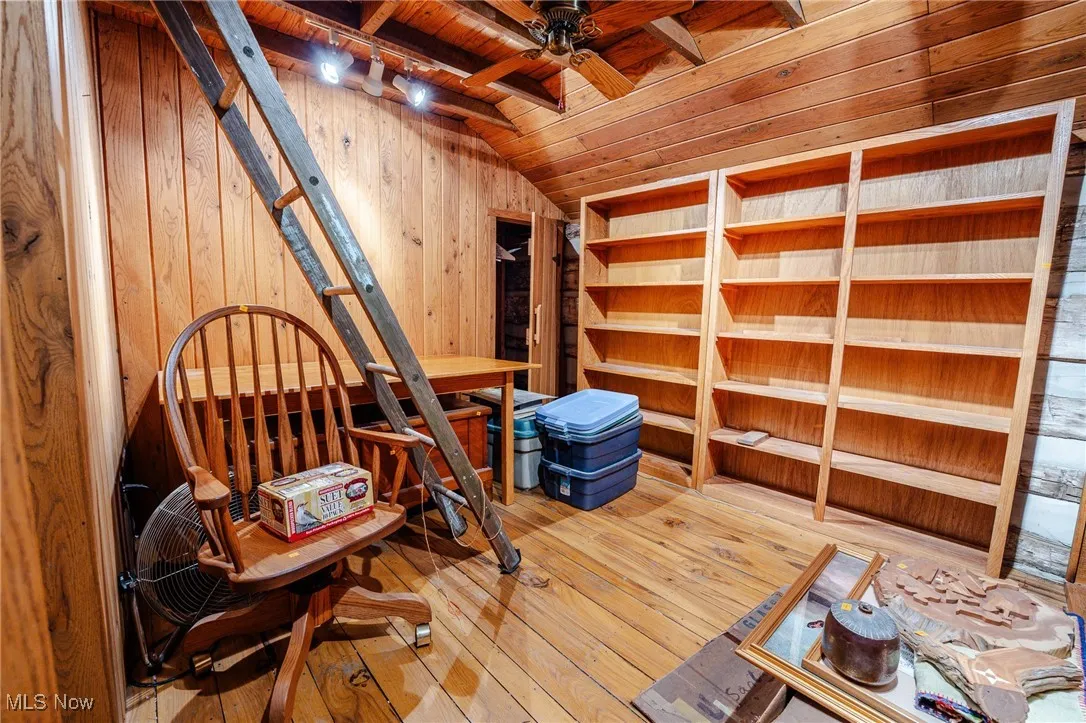 Storage area featuring a ceiling fan