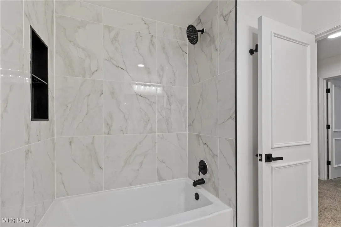 Bathroom featuring shower / bath combination