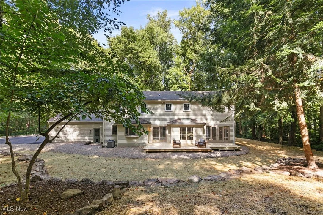 Rear view of property with a deck