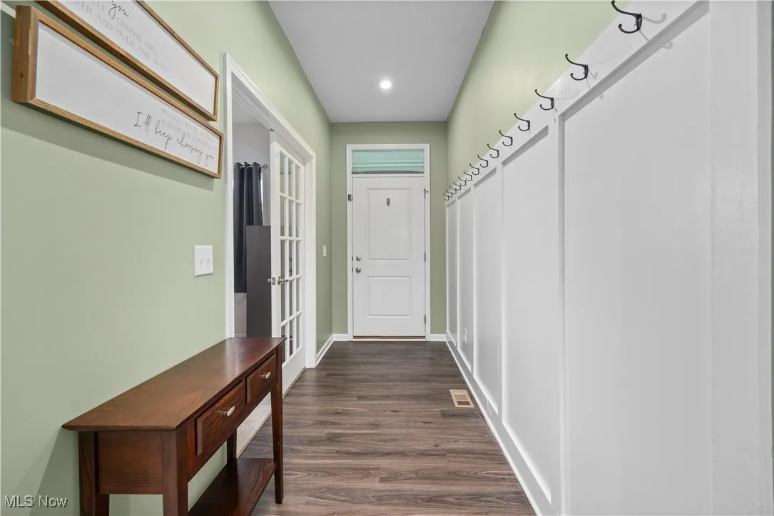 Doorway to outside featuring wood finished floors, french doors, and recessed lighting