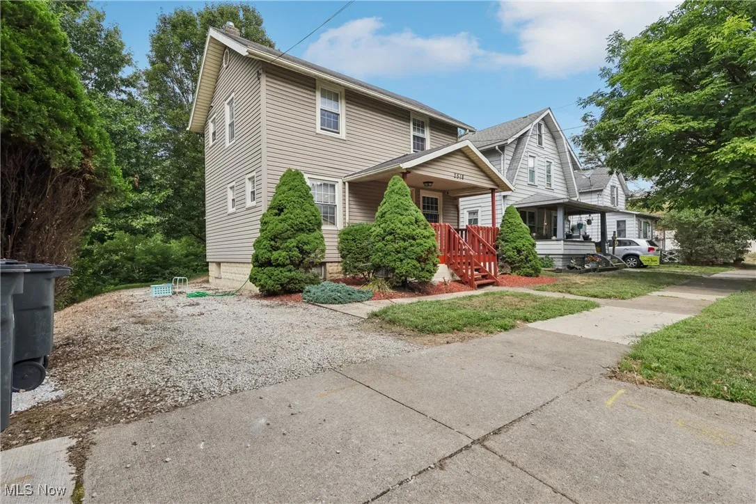 Side view of home with gravel driveway