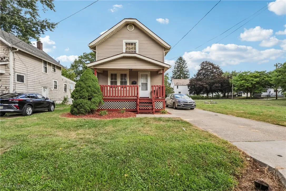 View of front of house with a covered front porch and concrete driveway
