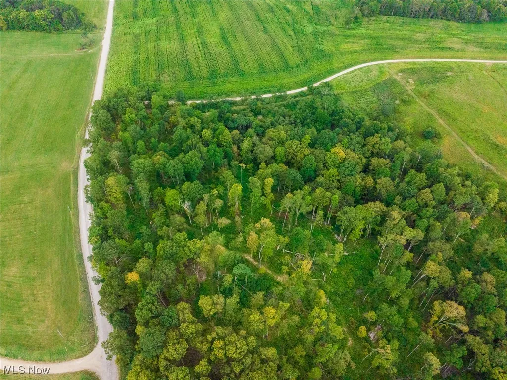 Aerial view of property and surrounding area with rural landscape