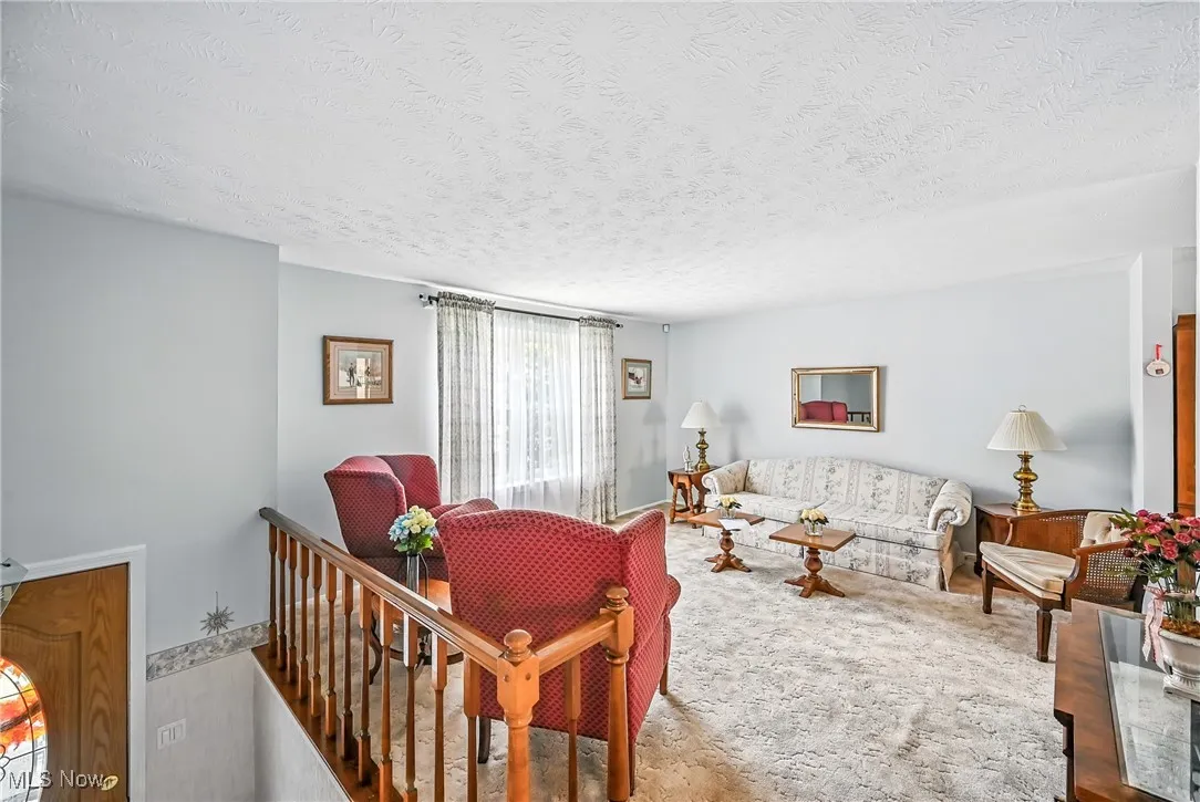 Living area featuring a textured ceiling