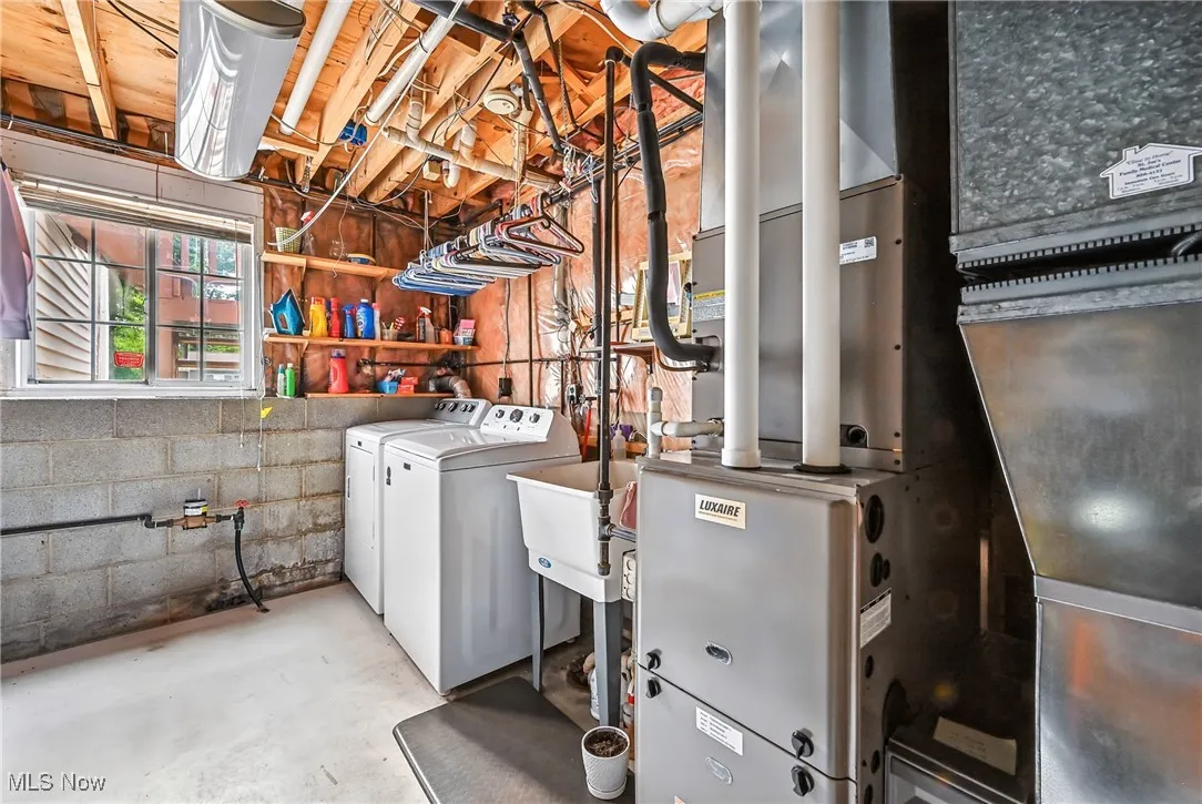 Utilities featuring heating unit and separate washer and dryer
