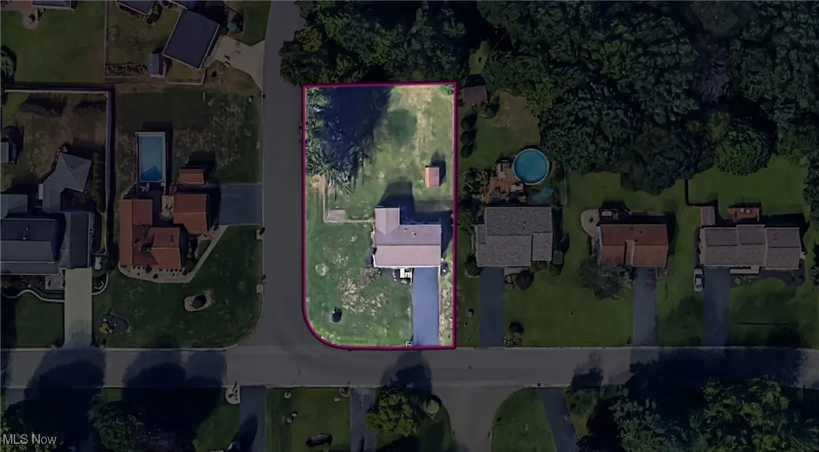 Aerial perspective of suburban area with property parcel outlined