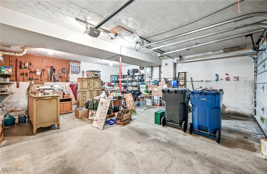 Garage with concrete block wall and a garage door opener