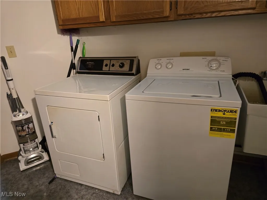 Laundry with washing machine and dryer and cabinet space