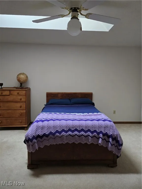 2nd Floor Bedroom with a skylight, carpet floors, and ceiling fan
