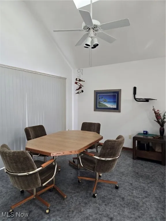 Kitchen eating area, with access to outside deck area vaulted ceiling, and a ceiling fan
