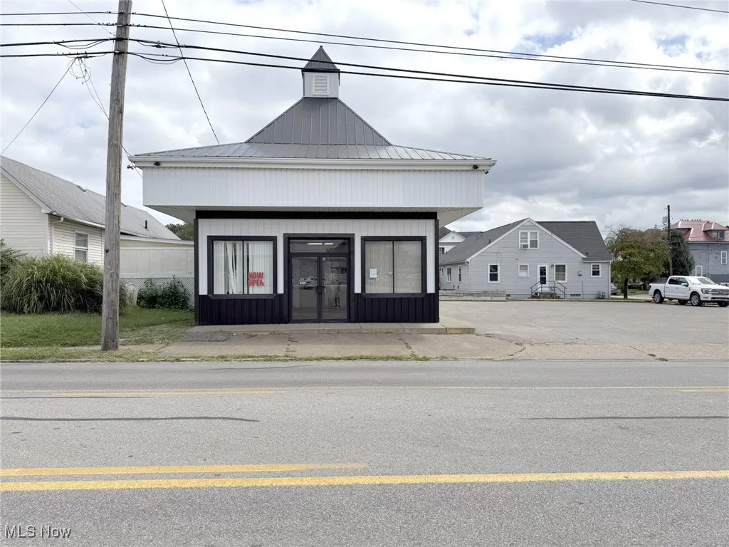 View of exterior entry featuring a metal roof, a standing seam roof, and french doors
