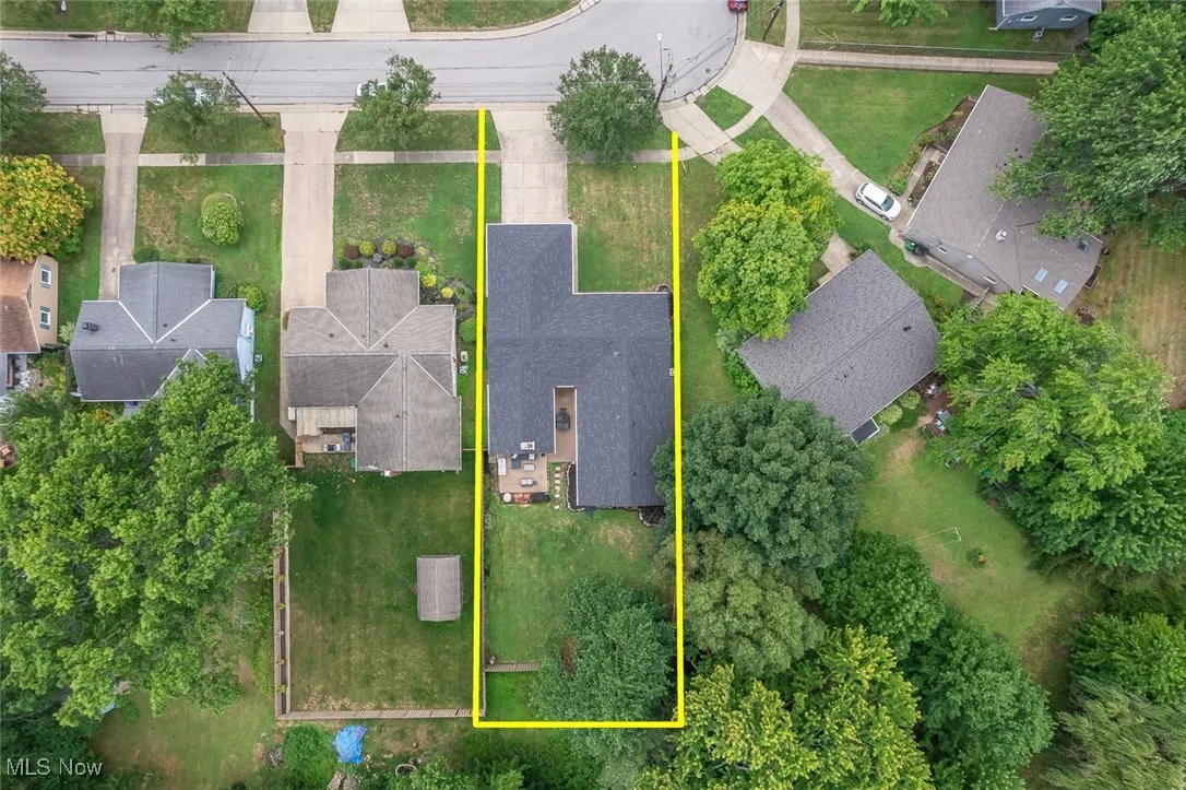 Aerial view of residential area featuring property boundaries highlighted