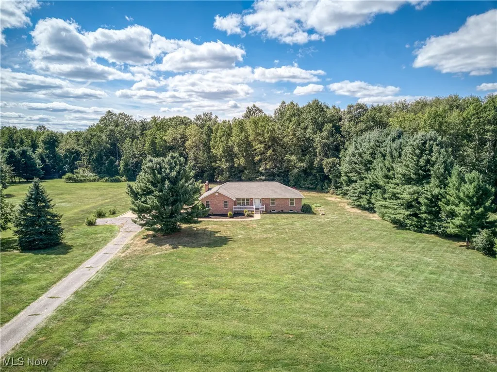 View from above of property featuring a forest