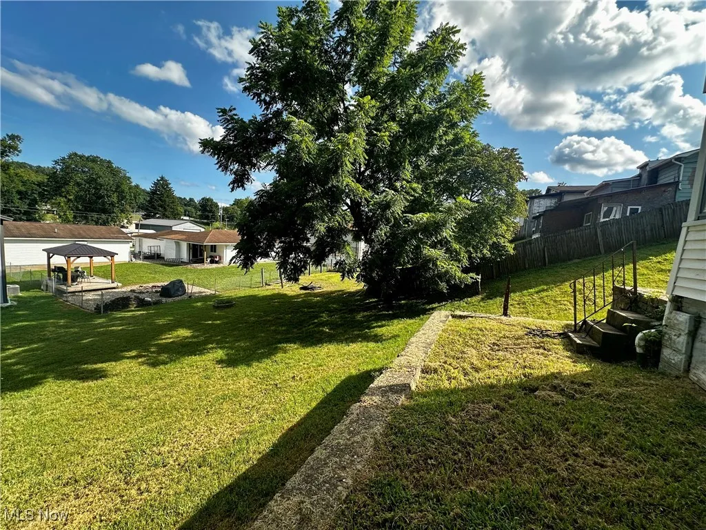 View of the backyard, just outside the lower level sunroom.