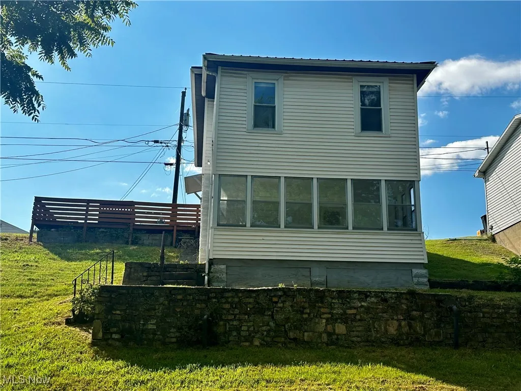 Another view of the back of the home. Owners have reasonably priced lawncare and will provide contact info.