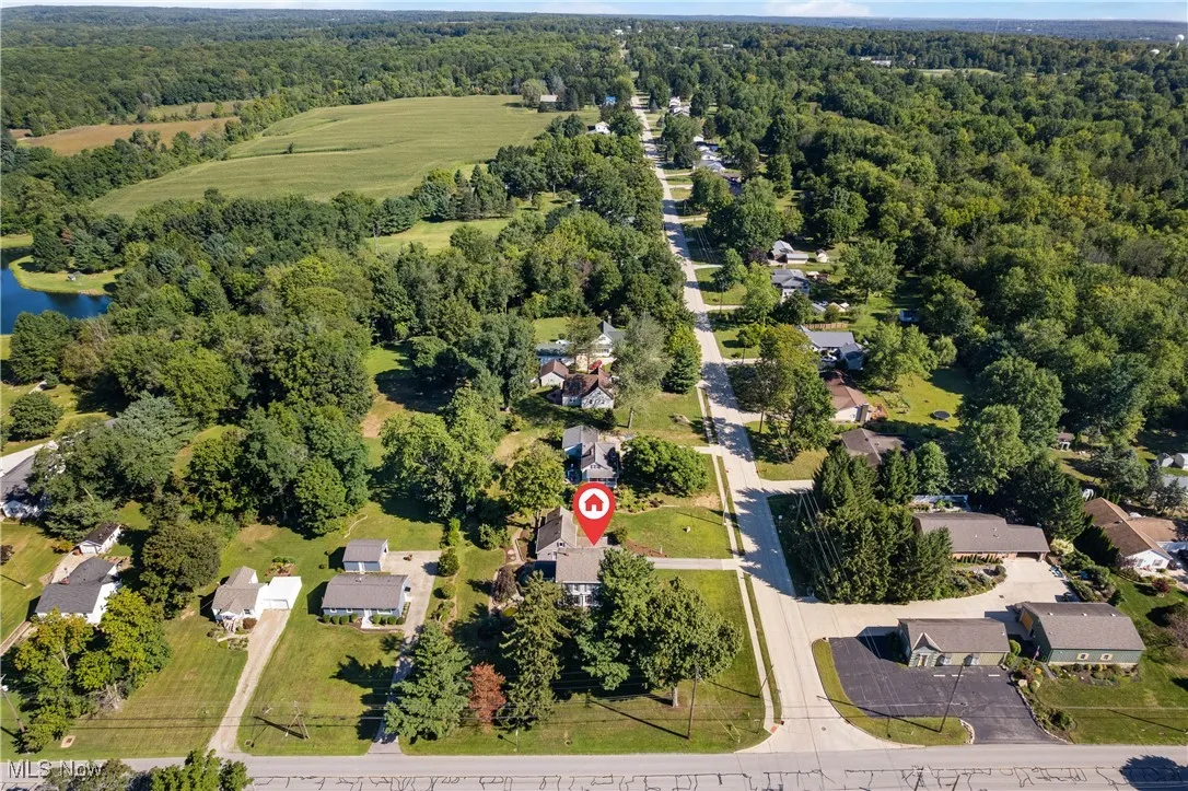 View of property location featuring nearby suburban area and a nearby body of water