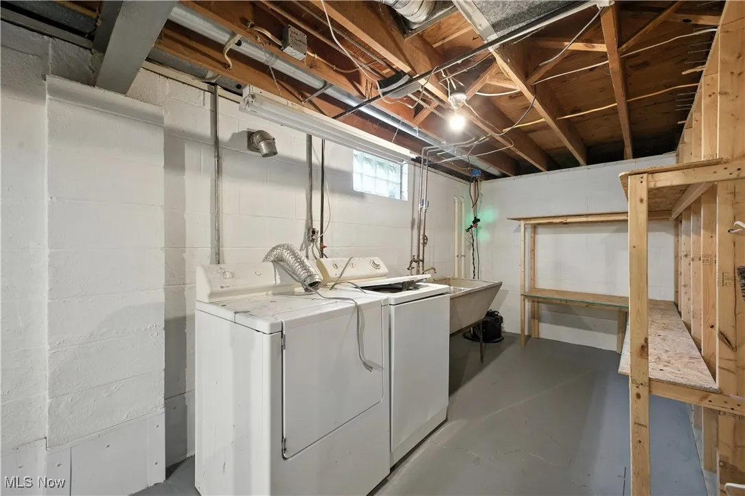 Laundry room with washing machine and dryer