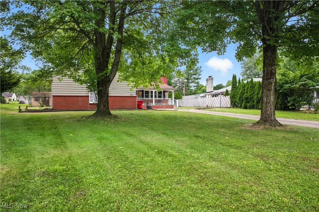 View of yard with a wooden deck