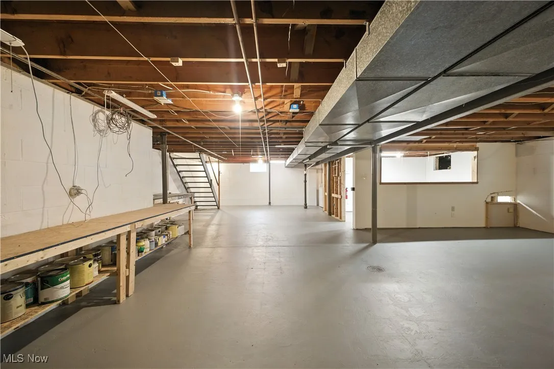 Basement featuring stairs