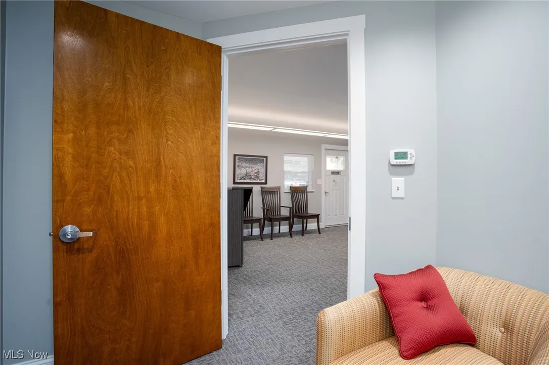 Hallway with carpet flooring