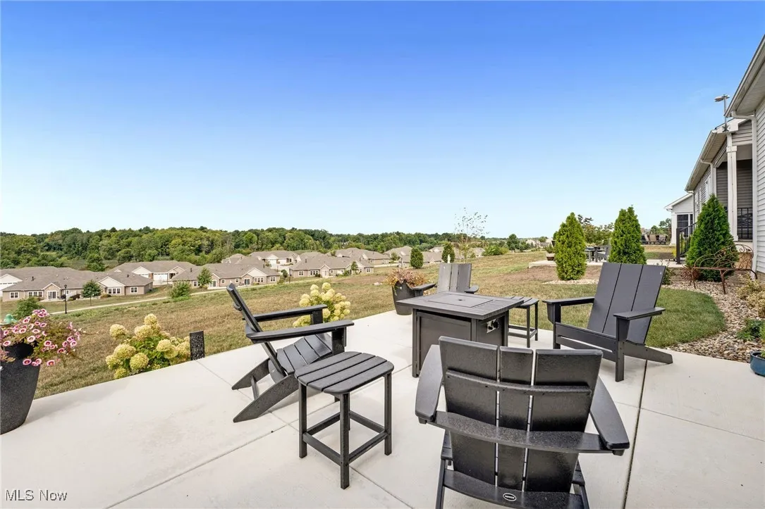View of patio / terrace with a residential view and a fire pit