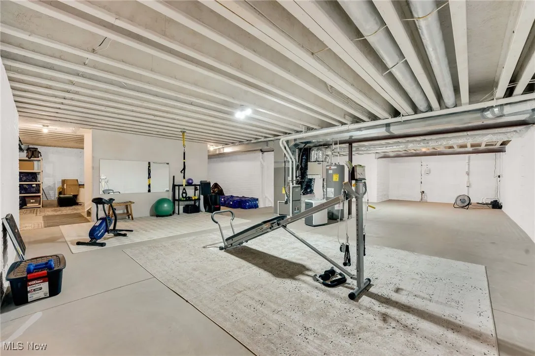 Workout area featuring water heater