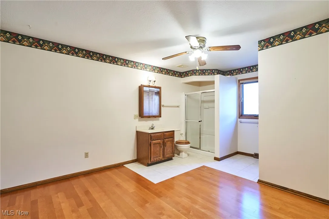First flor den/ bedroom with maple floors - This could be used as a first floor bedroom