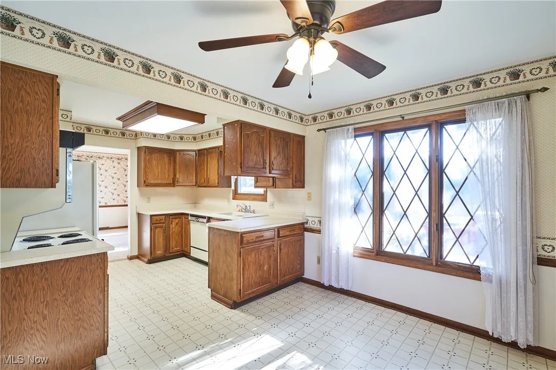 Kitchen featuring eating area and vinyl flooring