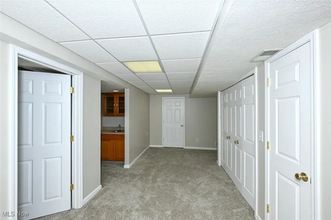 *FINISHED BASEMENT HAS 2 ENTRYS, ONE FROM HOME AND OTHER FROM GARAGE. RECREATION ROOM W/MULTIPLE WIDE CLOSETS FOR TONS OF STORAGE! PLUS EXTRA SINK, FAUCET AND CABINETS ~